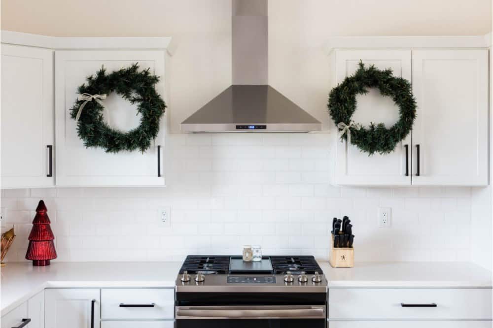 Use multiple wreaths to decorate around your kitchen hood